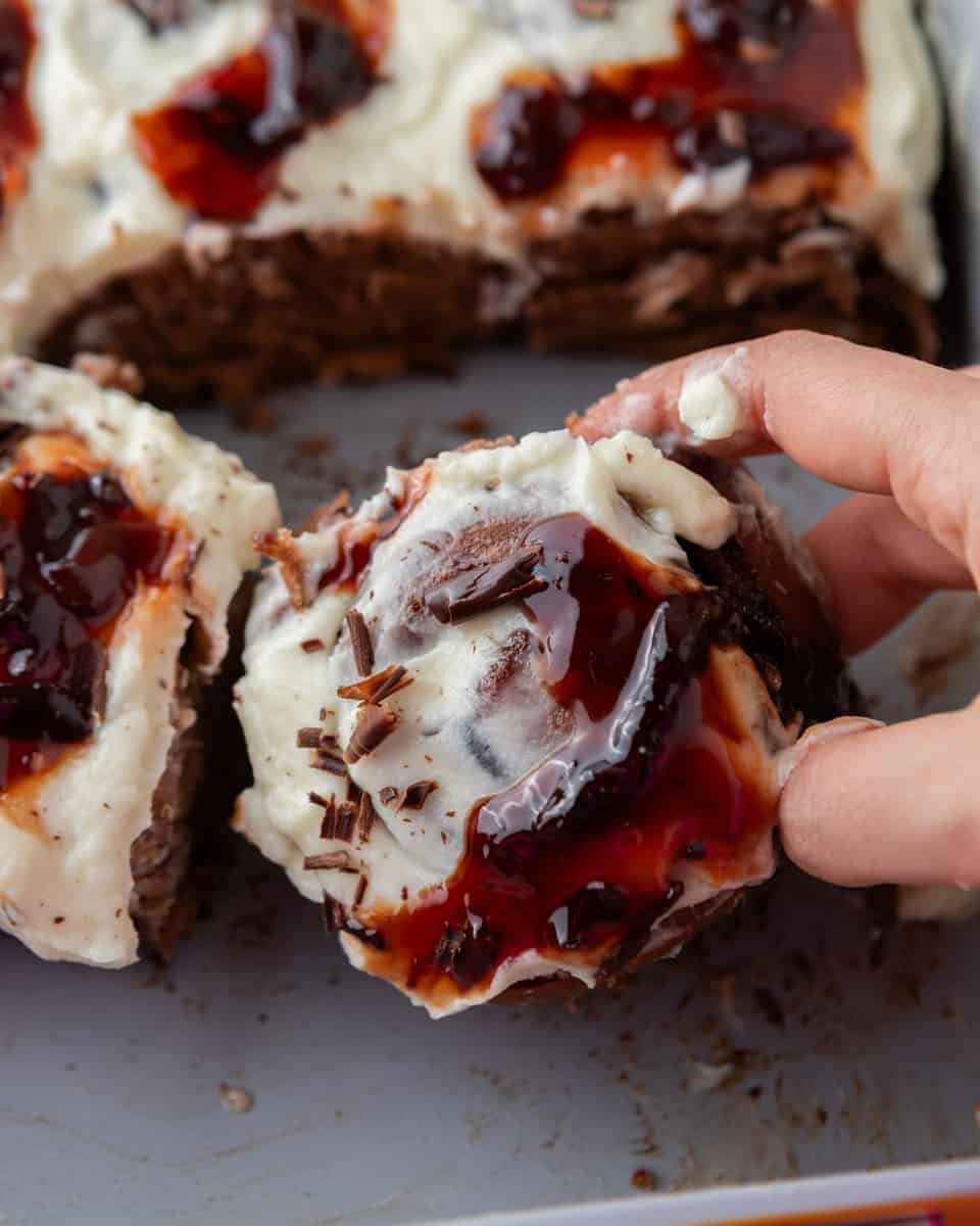 Black Forest cinnamon roll with cherry filling and mascarpone frosting