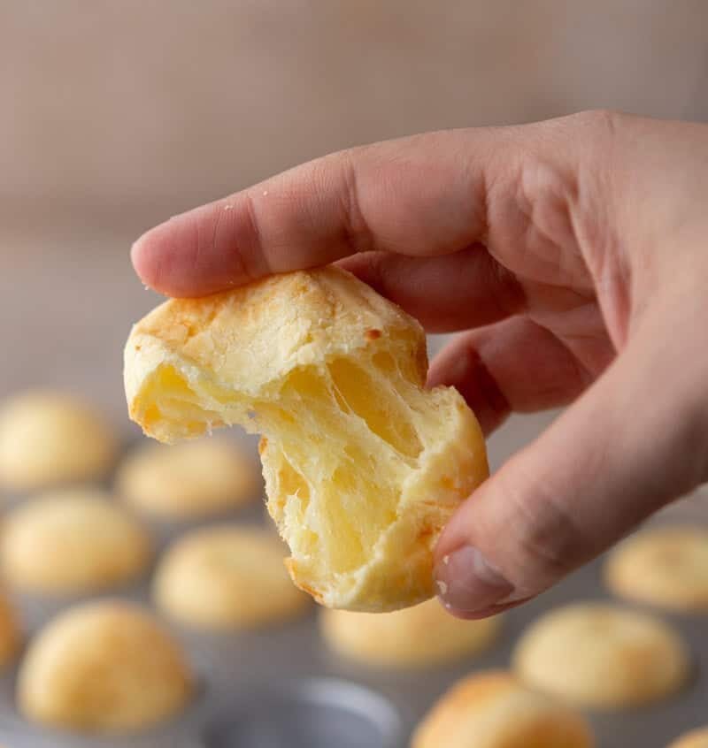 Steakhouse-style Brazilian cheese bread torn open showing