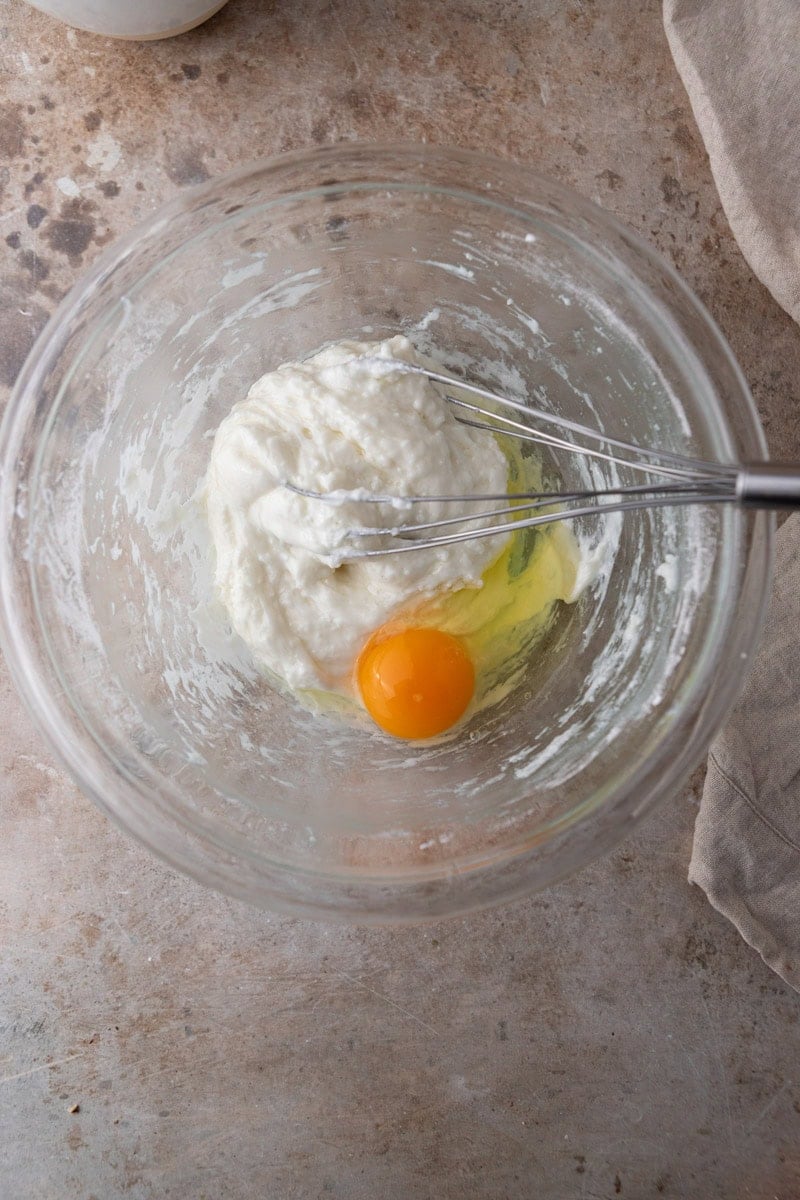 Egg added to warm tapioca dough for cheese bread batter