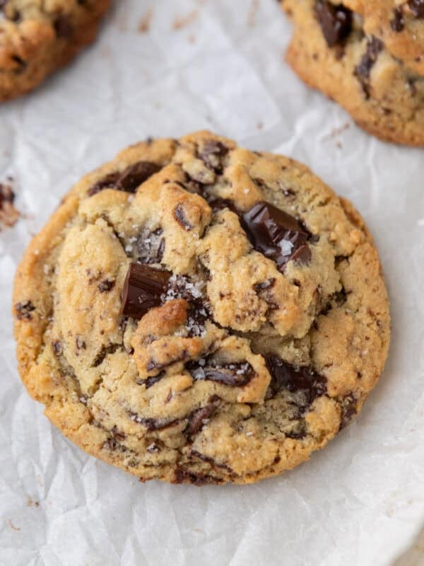 Soft and chewy cream cheese chocolate chip cookie on parchment paper