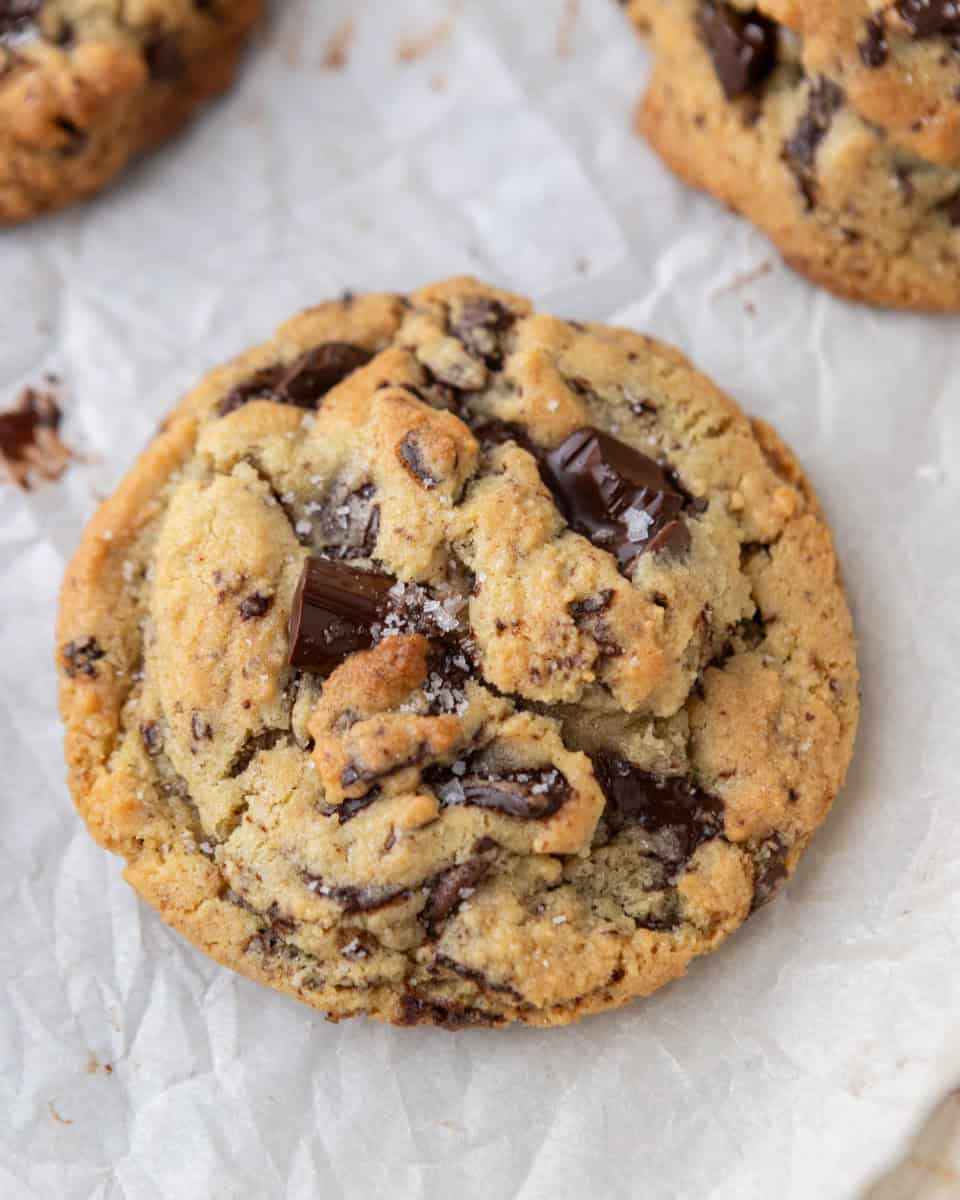 Soft and thick cream cheese chocolate chip cookies with crinkly tops, golden edges, and melted chocolate.