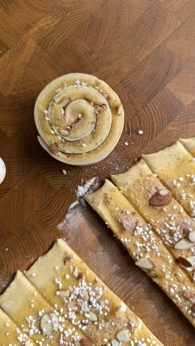 Almond frangipane spread thinly over rolled cinnamon roll dough
