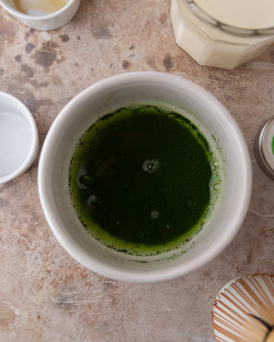 Matcha mixed with warm water before whisking