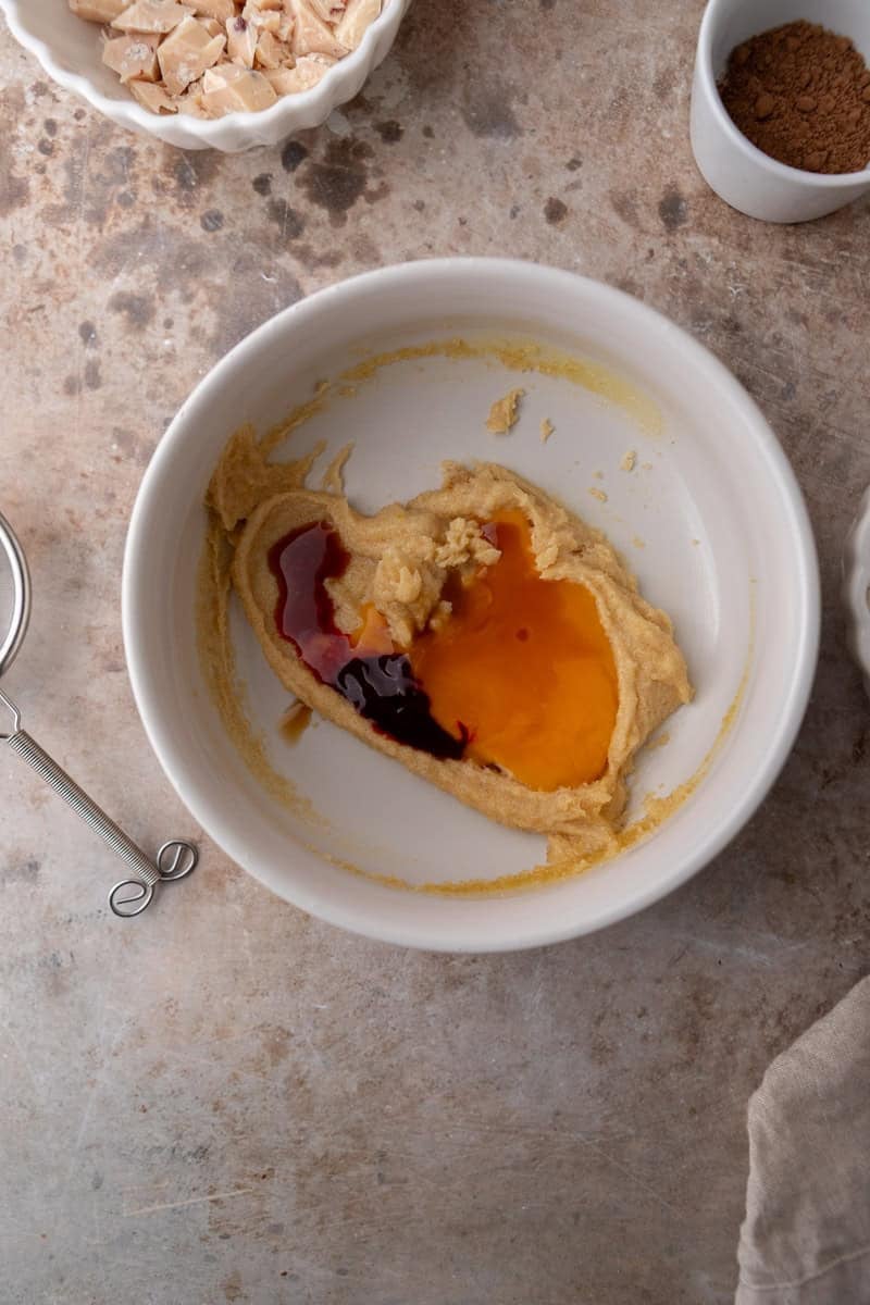 Egg yolk and vanilla extract added to cookie dough mixture