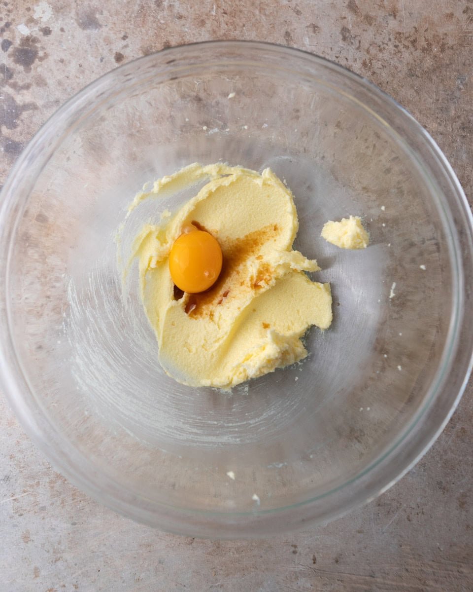 Butter, egg yolk, and vanilla mixed in a large bowl