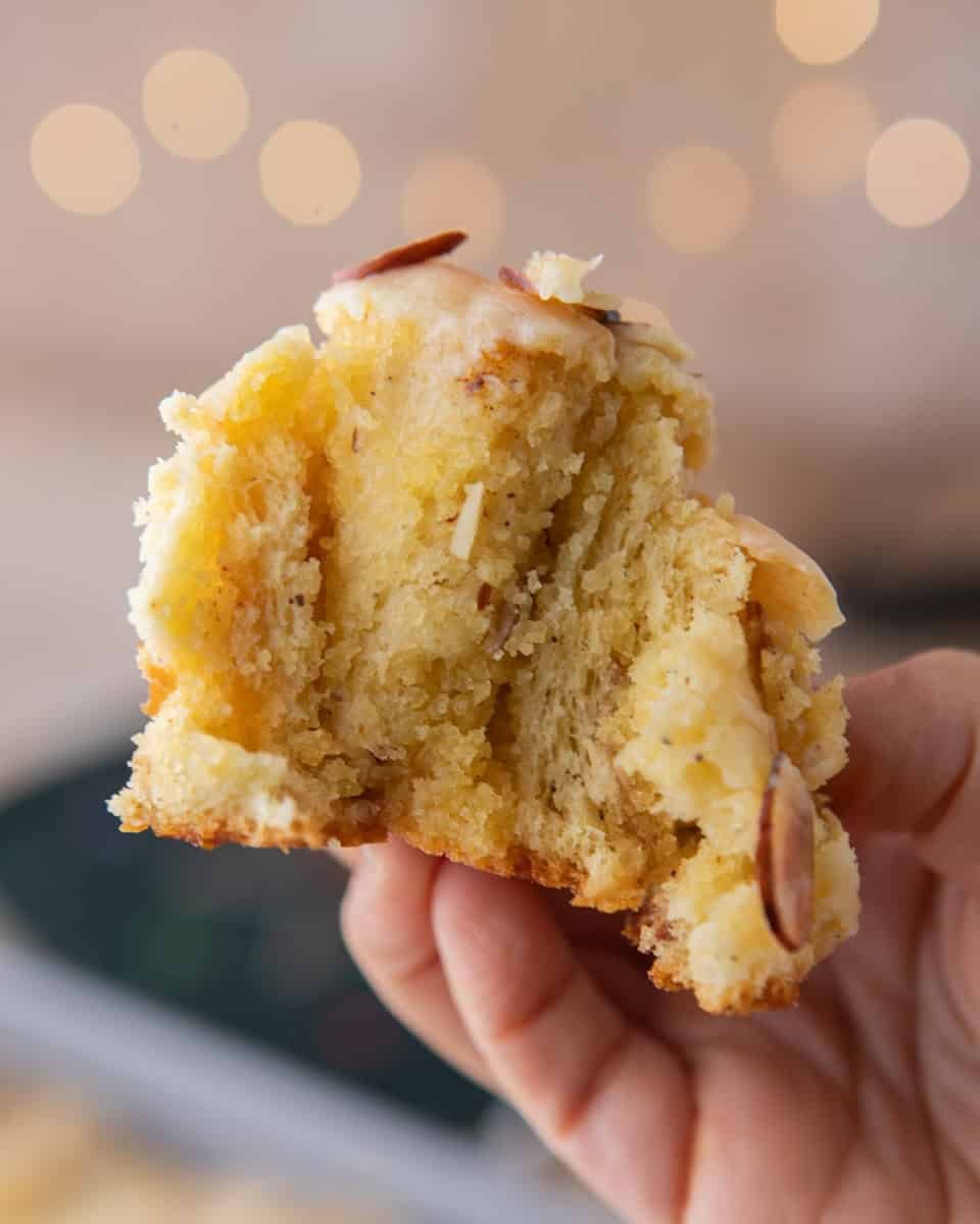 Almond croissant cinnamon rolls baked until golden brown with toasted slivered almonds and almond glaze