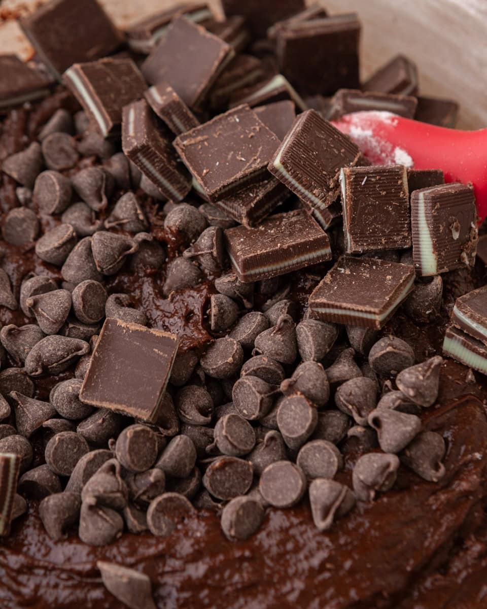 Chocolate chips and chopped mint chocolate candies mixed into brownie batter