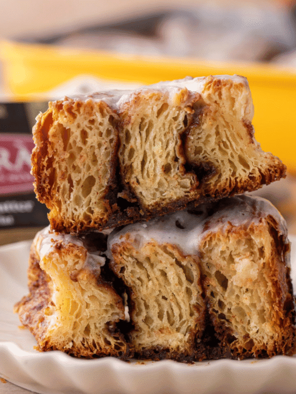 Croissant cinnamon rolls showing flaky laminated layers with cinnamon filling and glaze
