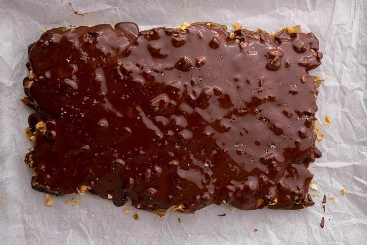 Melted dark chocolate spread over peanut butter and dates