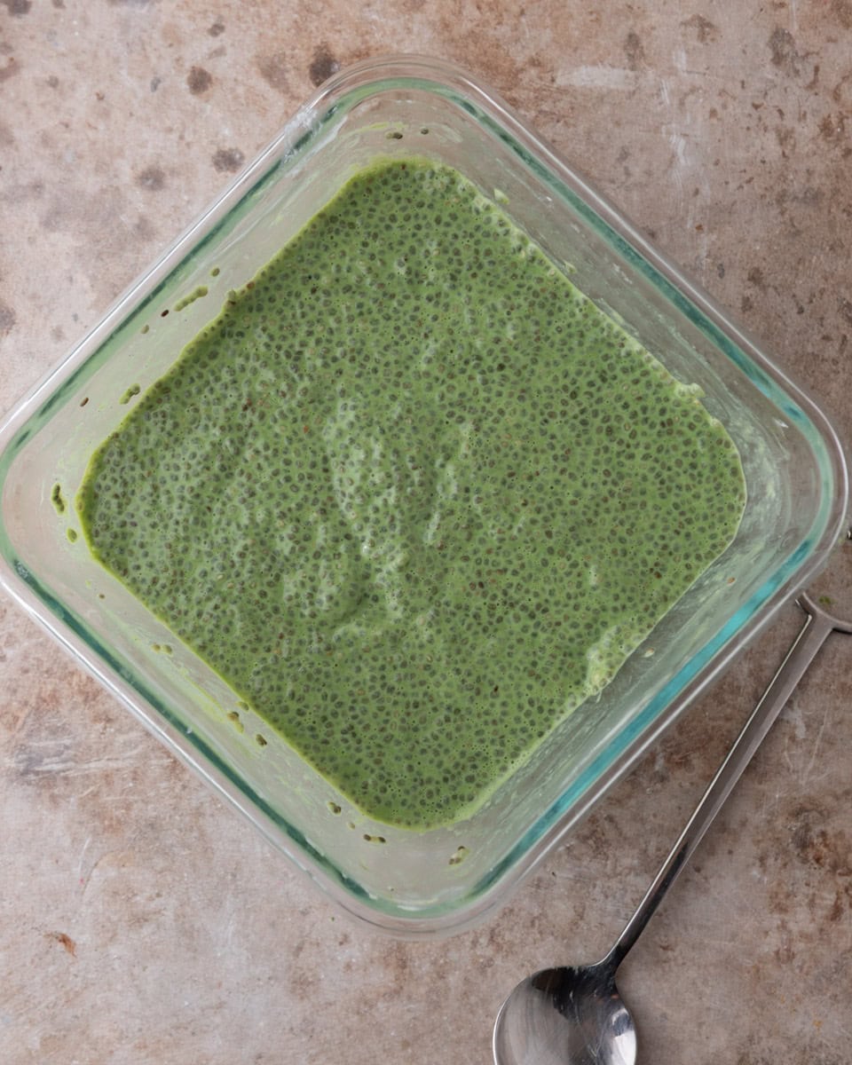 Freshly mixed matcha chia pudding mixture before refrigerating