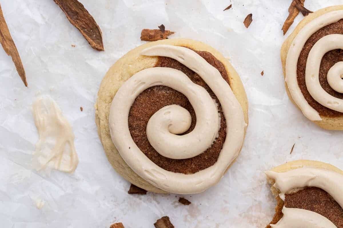 Crumbl maple cinnamon roll cookie with maple cream cheese frosting swirl