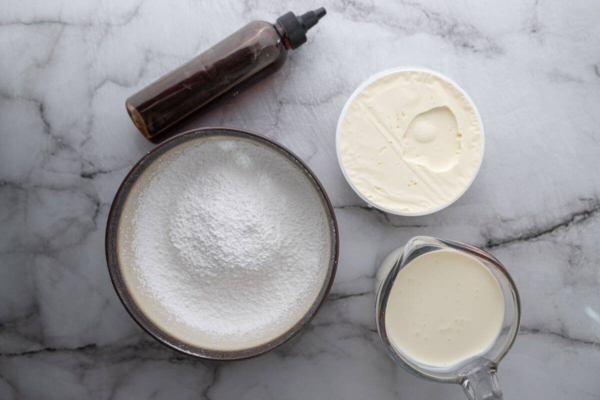 Ingredients including mascarpone cheese, heavy cream, powdered sugar, and vanilla extract