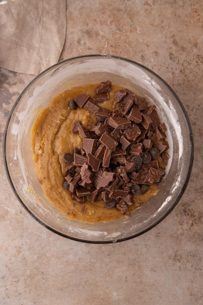 Chocolate chips and chopped chocolate folded into cookie dough