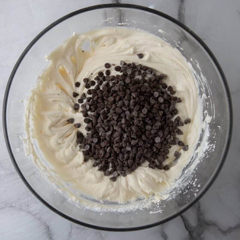 Ricotta and mascarpone mixture with mini chocolate chips folded in. Gently stirring the chips in at the end preserves their shape and even distribution.