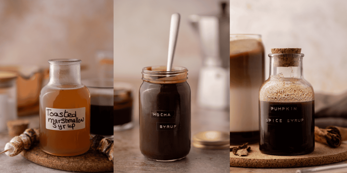 Three homemade coffee syrup recipes in glass jars, toasted marshmallow, mocha, and pumpkin spice