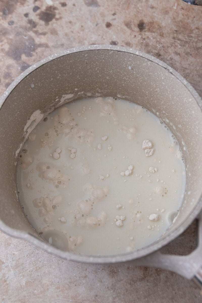 Flour and milk whisked together in a small saucepan before cooking for tangzhong