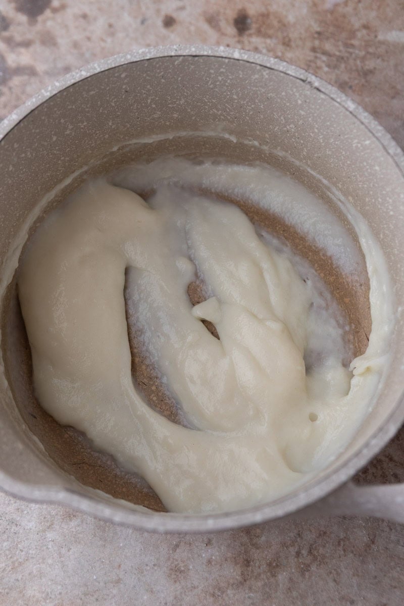 Cooked tangzhong paste in a saucepan, thick and glossy
