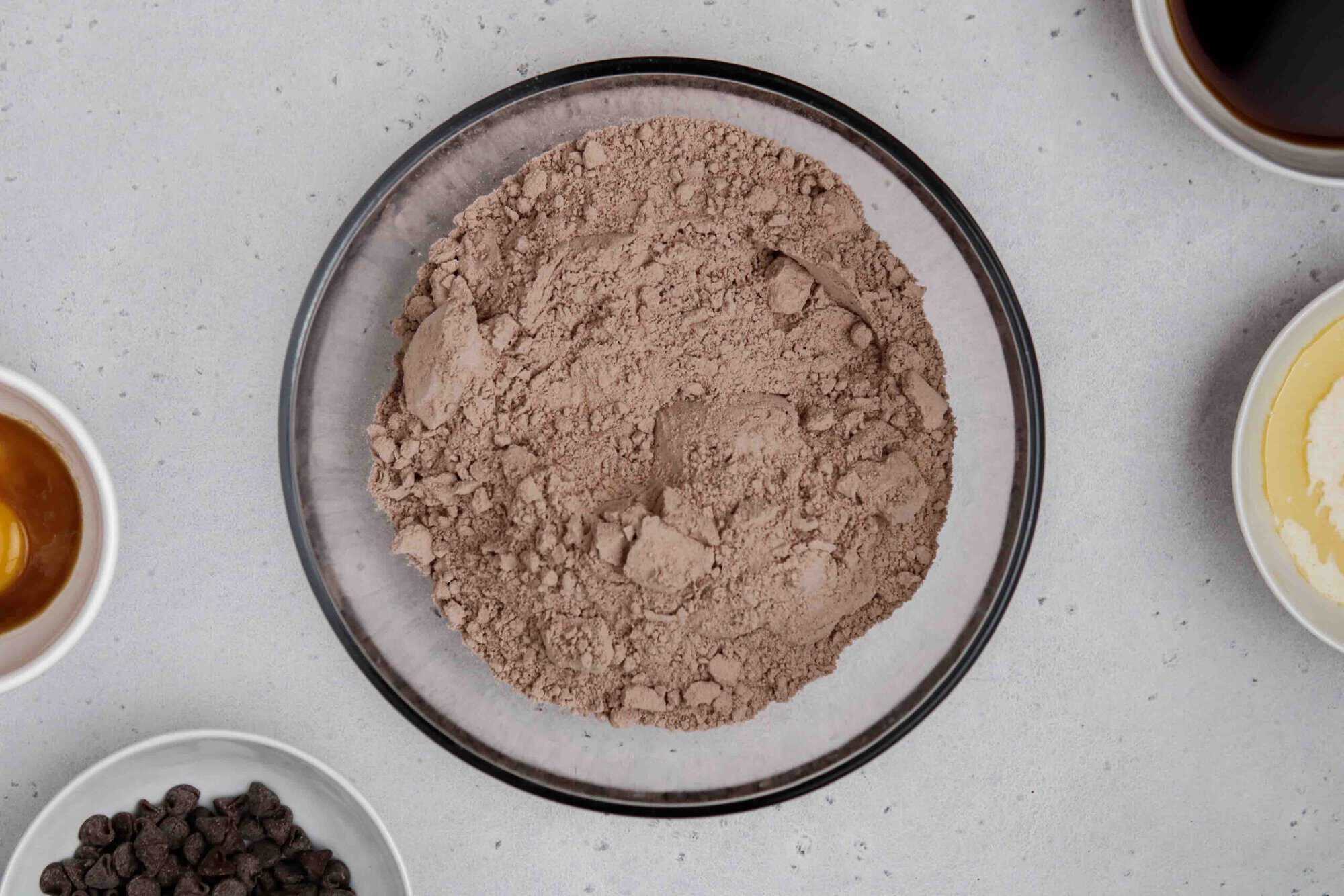 Dry brownie ingredients in a bowl before improving it with mixins.