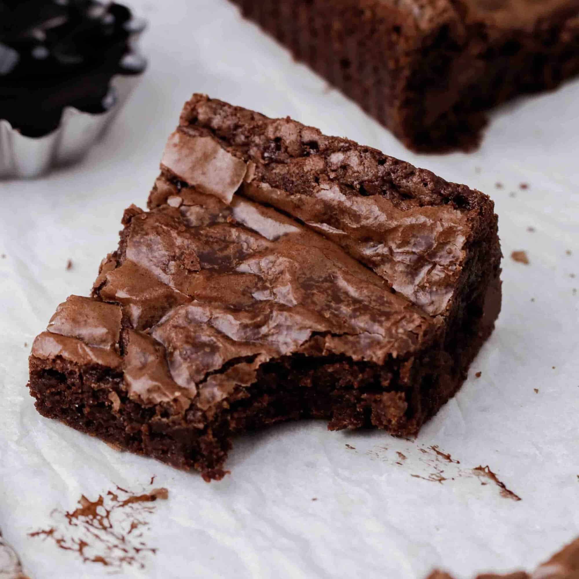 Doctored up brownie slice with a bite taken out of it.