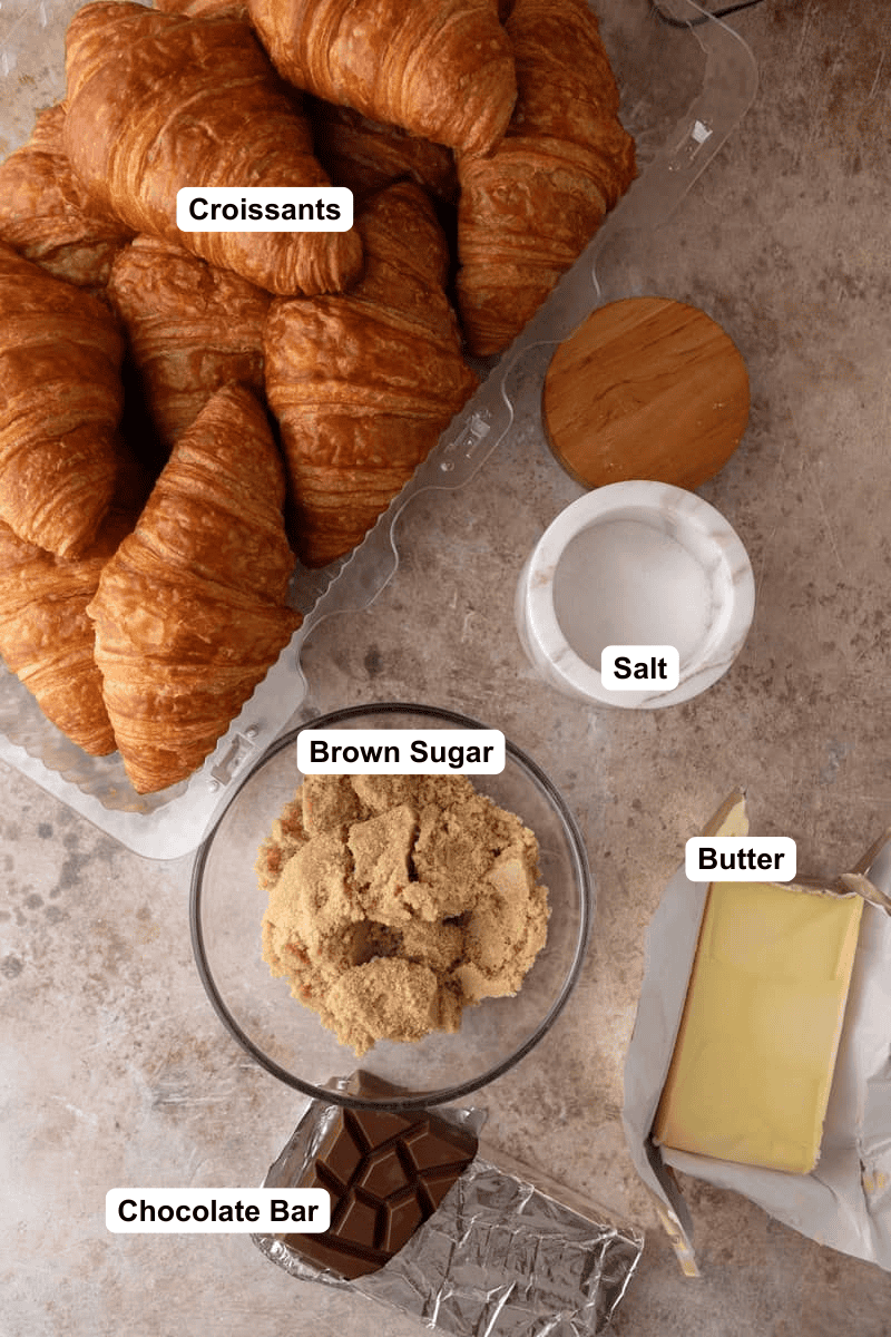 Croissant Christmas crack ingredients: croissants, brown sugar, butter, a dark chocolate bar and flaky salt.