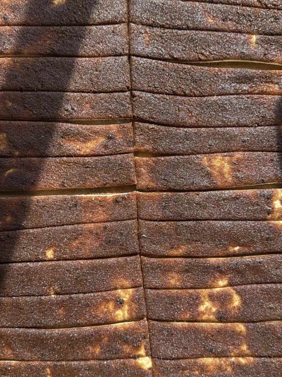 Cinnamon sugar spread on the dough and sliced before rolling