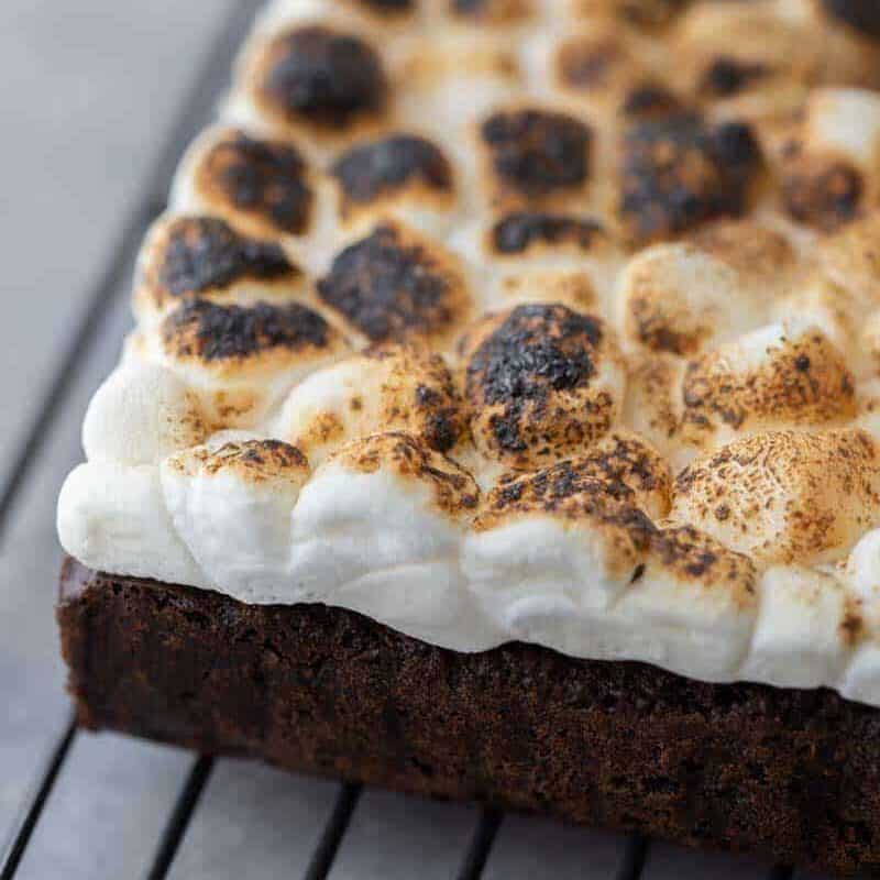 Baked s'mores brownies topped with mini marshmallows before toasting
