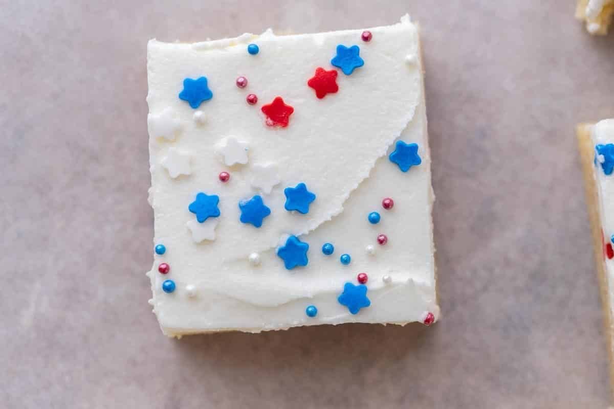 Freshly baked sugar cookie bar base cooling in the pan before frosting