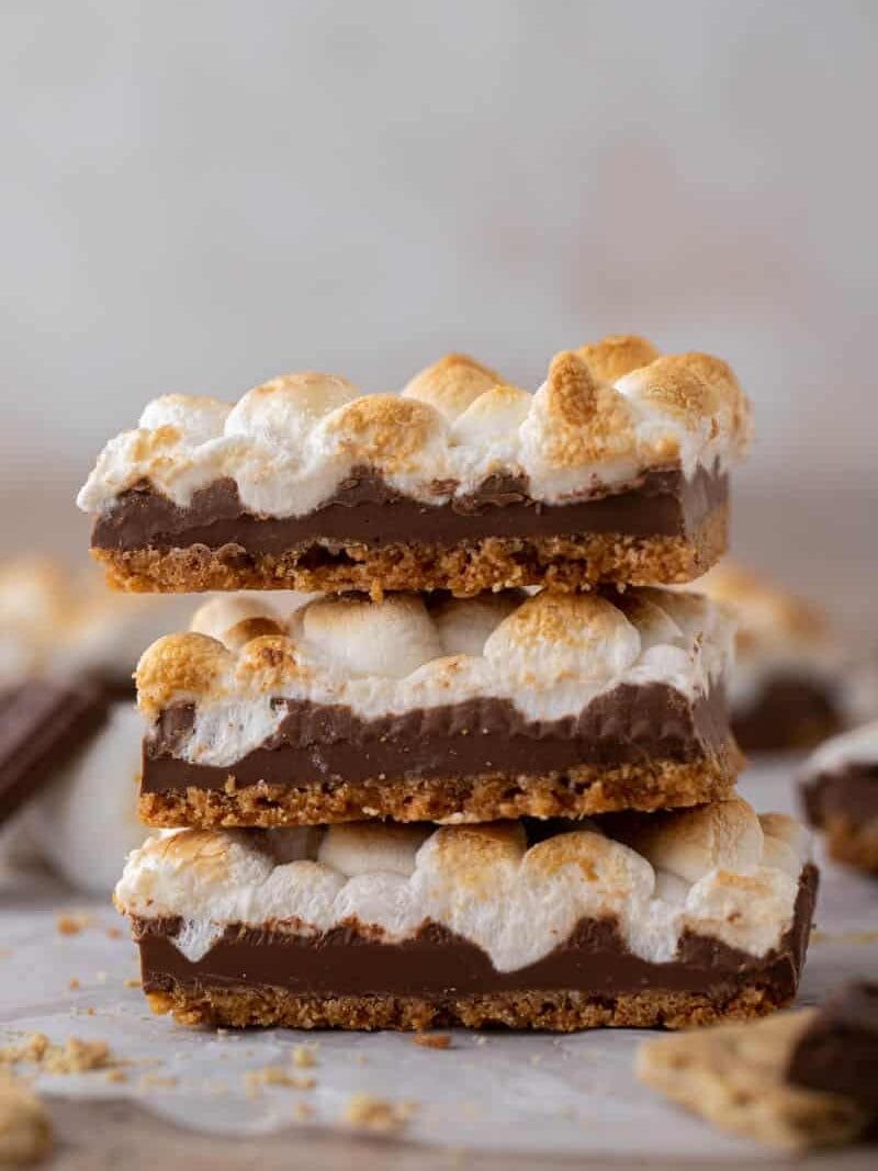 Stack of three Starbucks s'mores bars showing the graham, chocolate, and toasted marshmallow layers