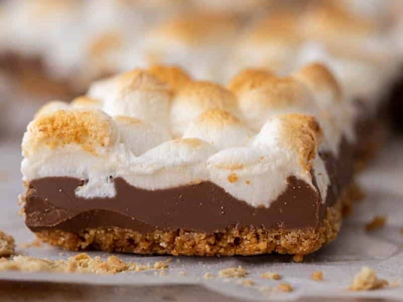 Side view of a Starbucks s'mores bar showing the graham cracker crust, milk chocolate, and toasted marshmallow layers