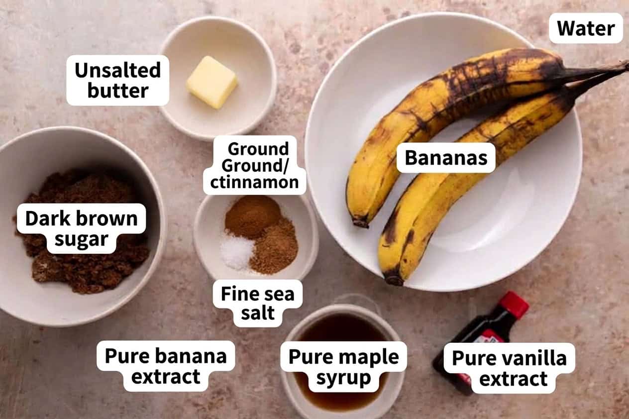 ingredients for banana bread syrup laid out in white bowls including overripe bananas, butter, dark brown sugar, cinnamon, maple syrup, and banana extract.