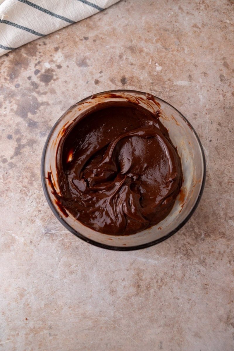 mooth melted chocolate ganache in a glass bowl