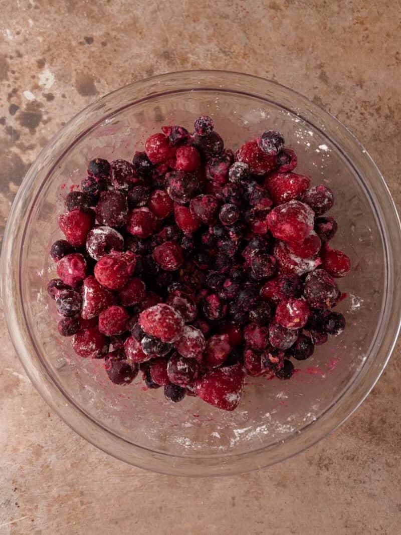 Mixed berries tossed with sugar, cornstarch, and lemon for the cobbler filling