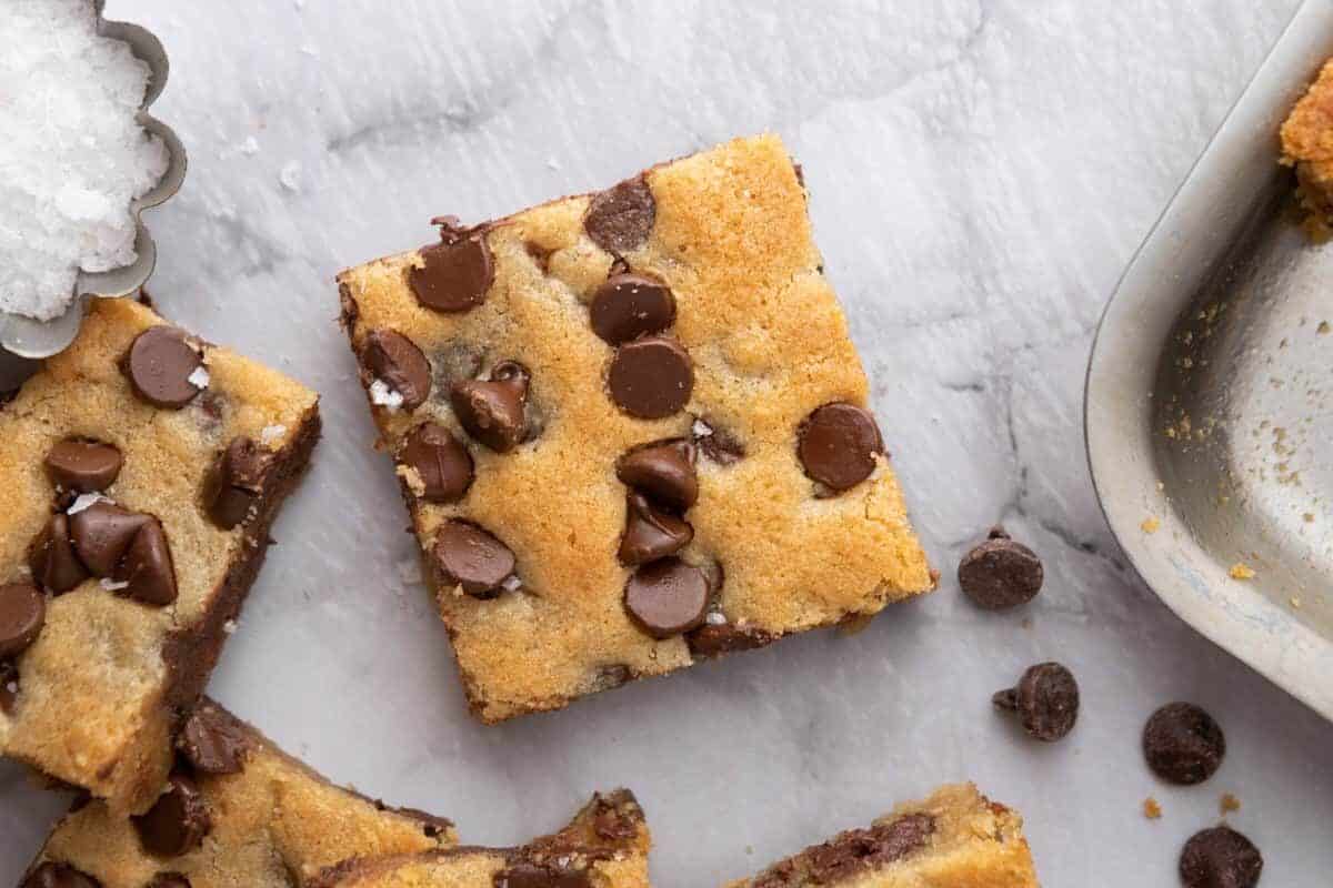 Soft and chewy Nestle Toll House chocolate chip cookie bars stacked on a plate