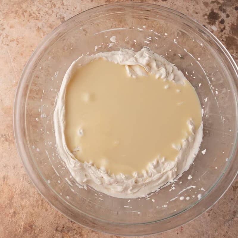 Whipped cream and mascarpone folded together for no churn tiramisu ice cream