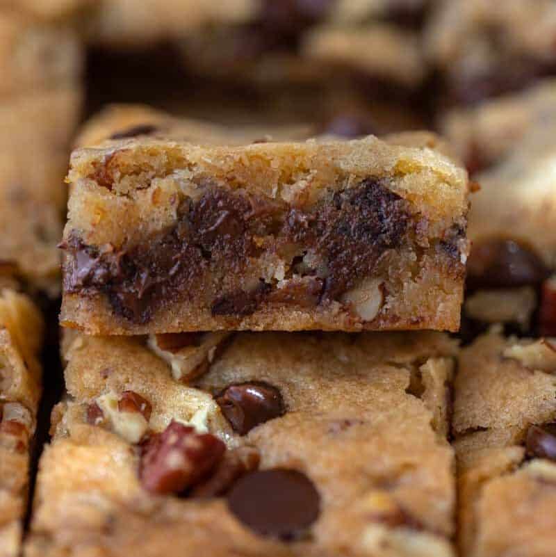 Slice of pecan chocolate chip cookie bar