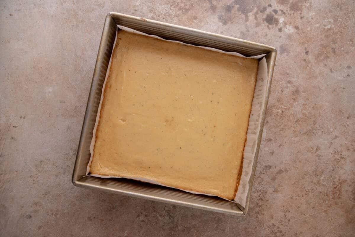 aked s'mores cheesecake bars cooled in the pan, set and ready for the chocolate ganache layer