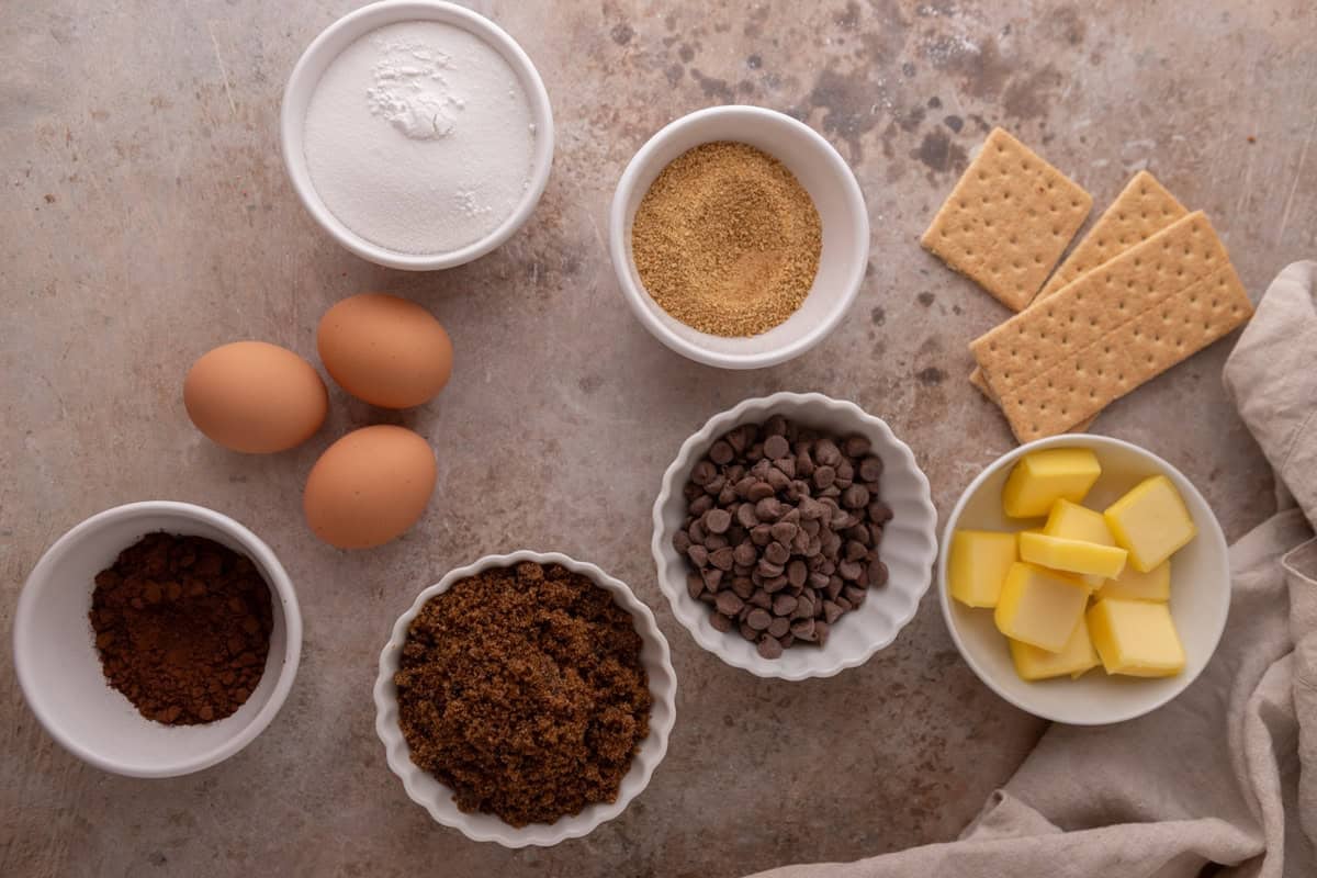 Chocolate graham filling ingredients including cocoa powder, brown sugar, chocolate chips, butter, eggs, and graham crackers