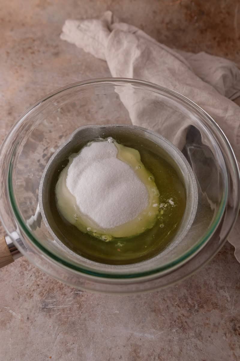 Egg whites and sugar in a glass bowl to make Swiss meringue