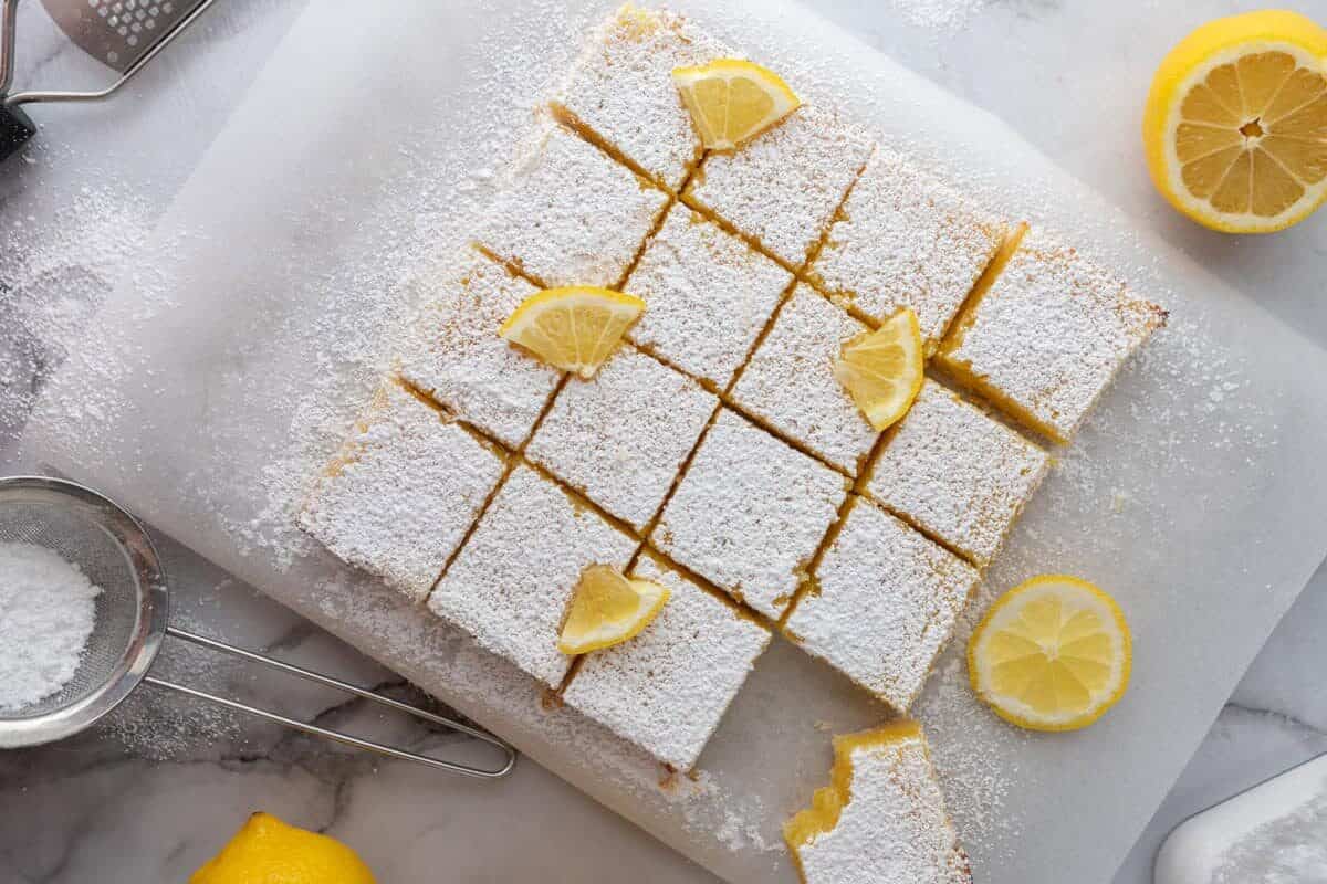 fully baked easy lemon bars recipe cut into squares