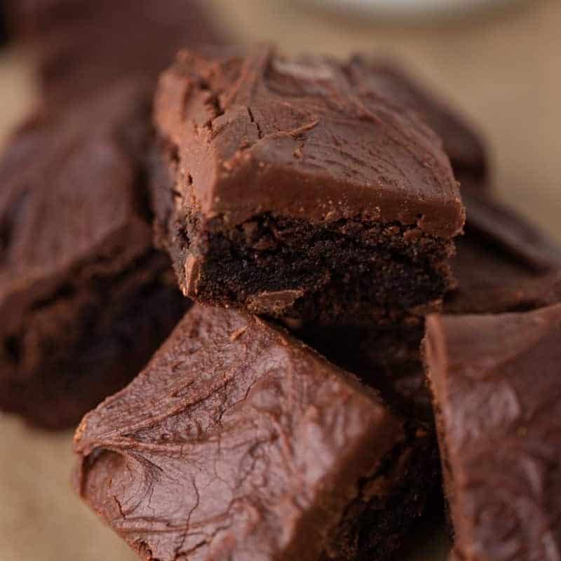 Brownies with frosting layered in a pile