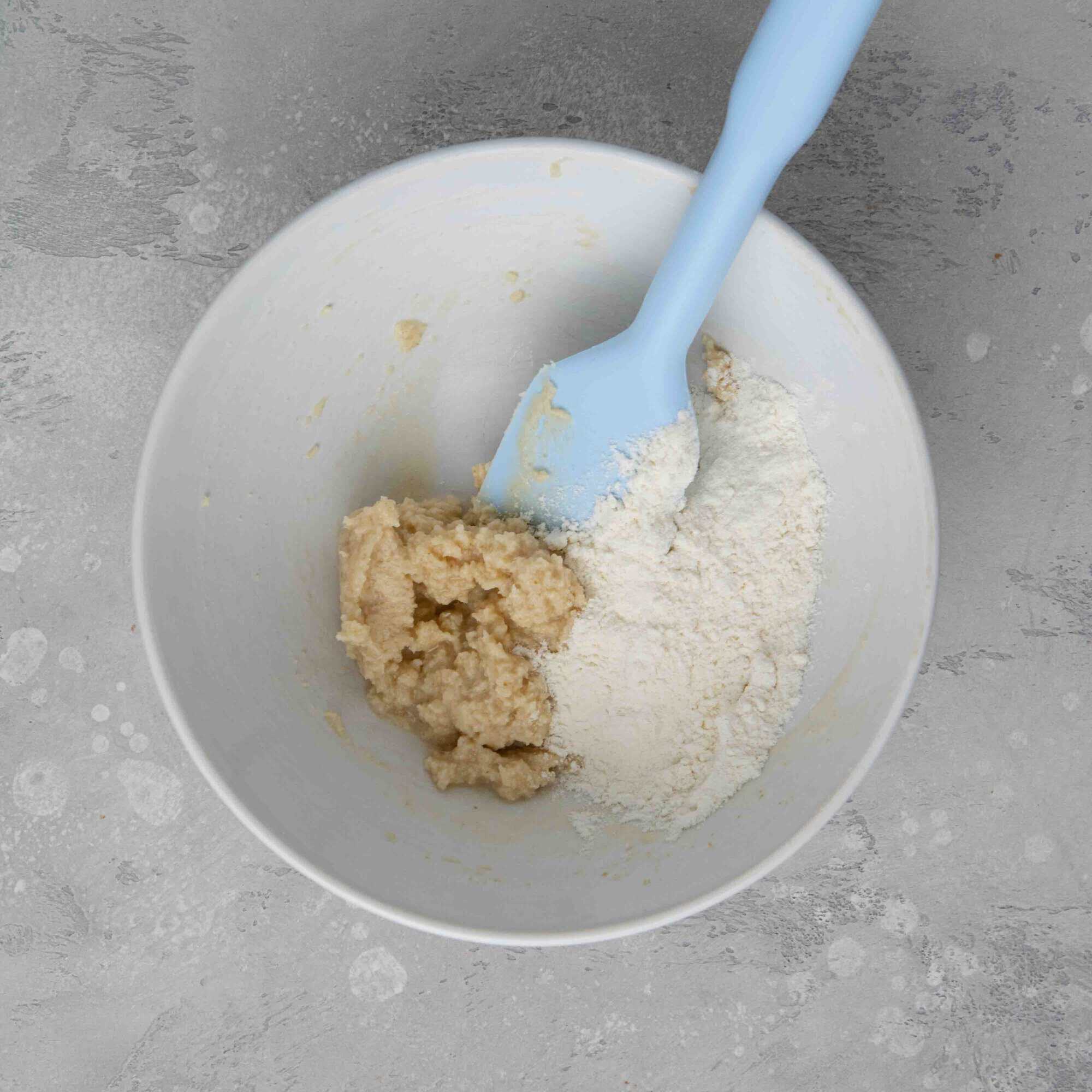 Adding flour to creamed butter mixture