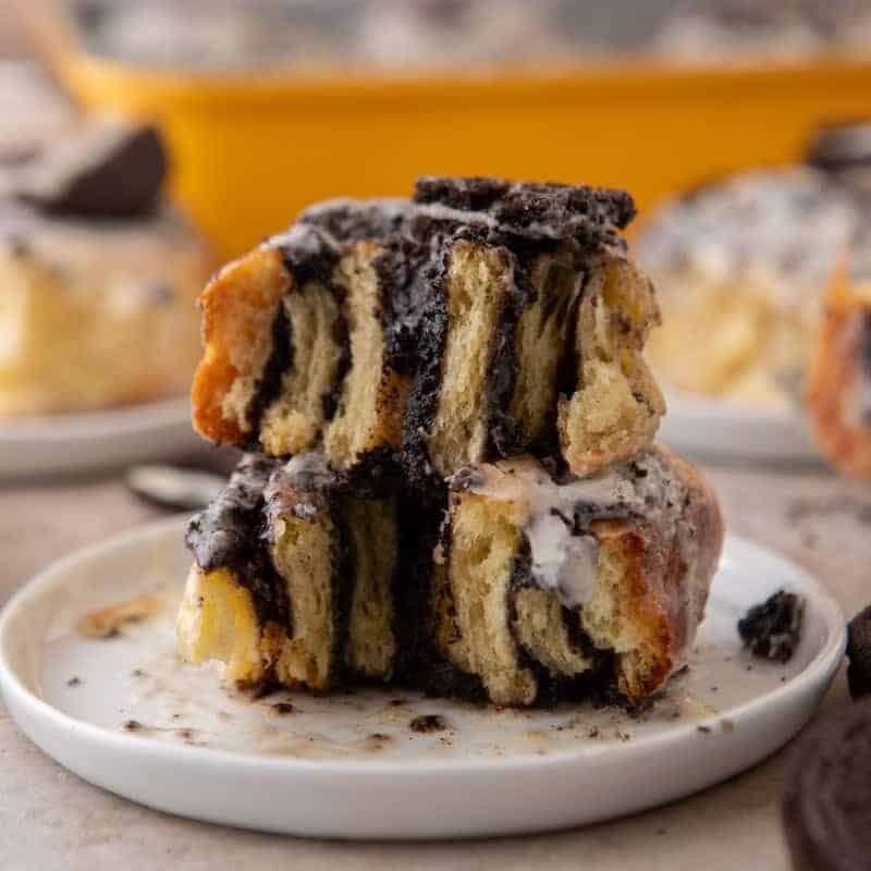 Cross section of Oreo cinnamon rolls stacked showing the filling layers and glaze