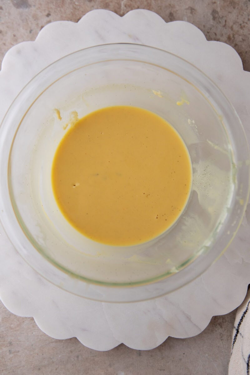 Whisked egg and cream mixture turned pale orange and smooth before going into the flour.
