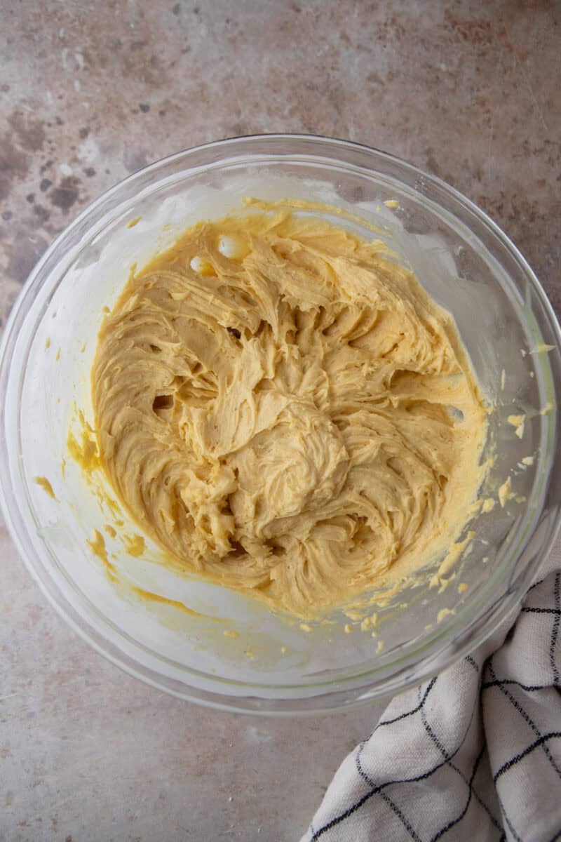 Honey tea cake batter thickening in the mixer bowl after adding in the liquid.