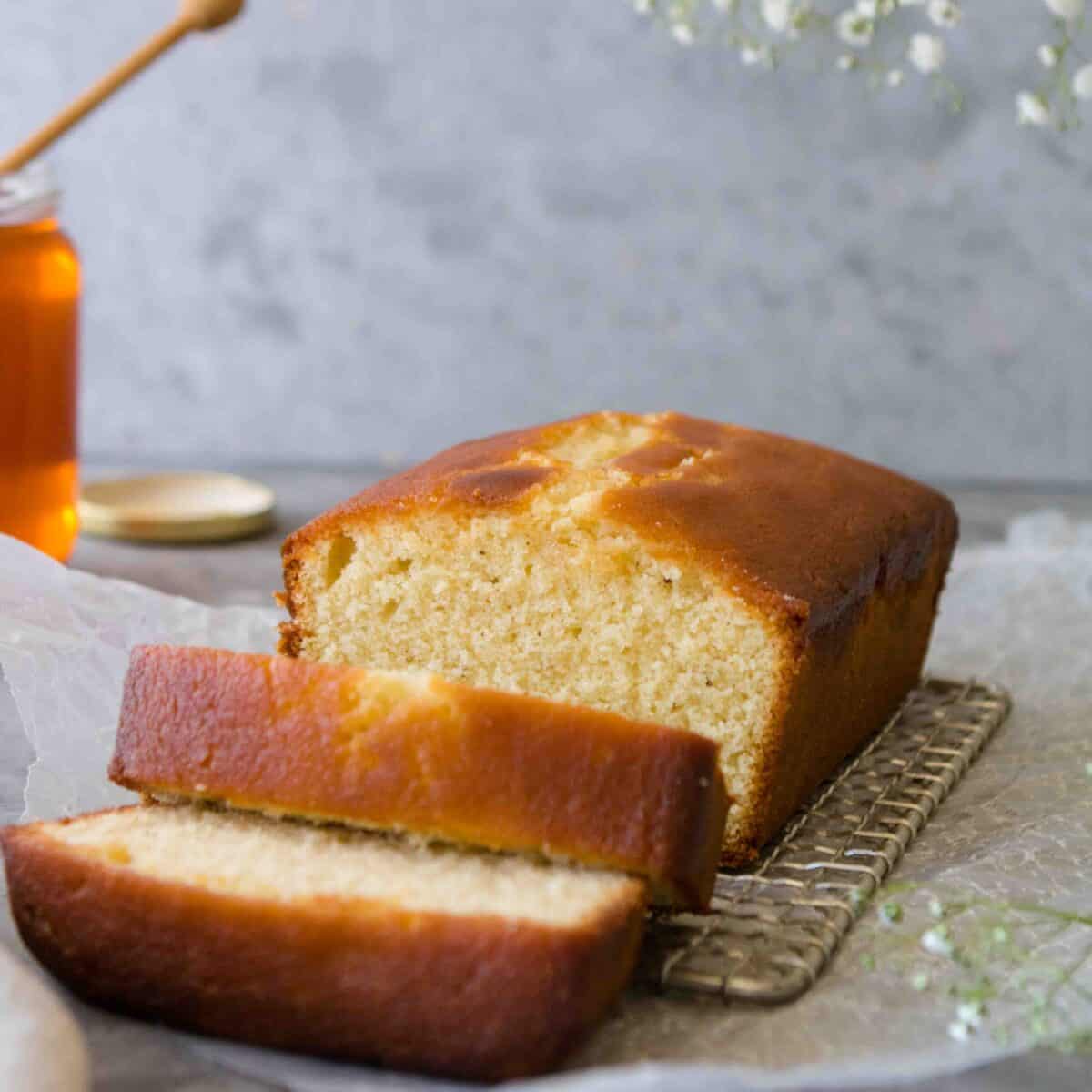 Sliced Honey Tea Cake loaf to show the loaf's color and texture.