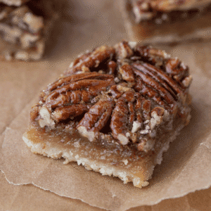 Easy pecan pie bars with shortbread crust and gooey pecan filling.